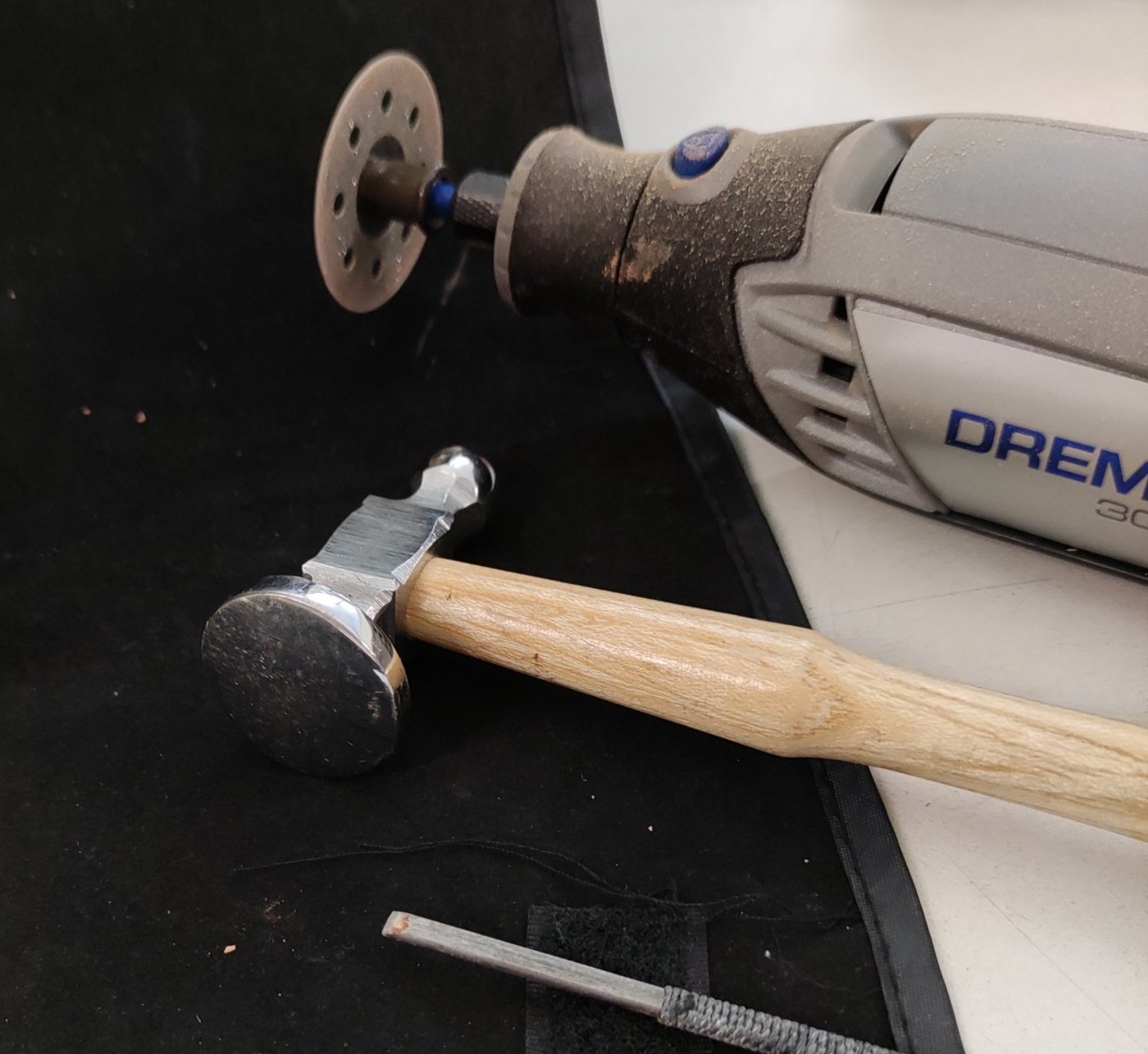 Rotary tool, hammer, and file on the sampling table